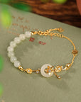 Women’s Hetian Jade Lotus Peace Buckle Bracelet – Retro 925 Silver Elegance