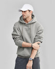 Sweat à capuche imprimé contrasté en peluche pour hommes