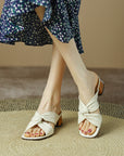 Chaussons à talons en peau de mouton FEMME
