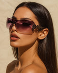 Women’s One-Piece Rimless Sunglasses – Concave Styling with Bold Elegance